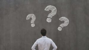 Guy thinking of questions to ask